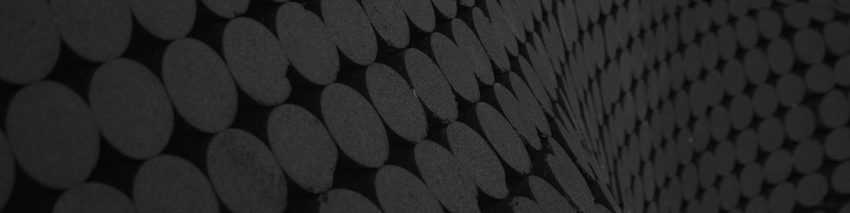 Dark gray circles on a black curving background